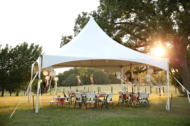 Sunset view of decorated tent with lanterns and party setup in Riverview FL